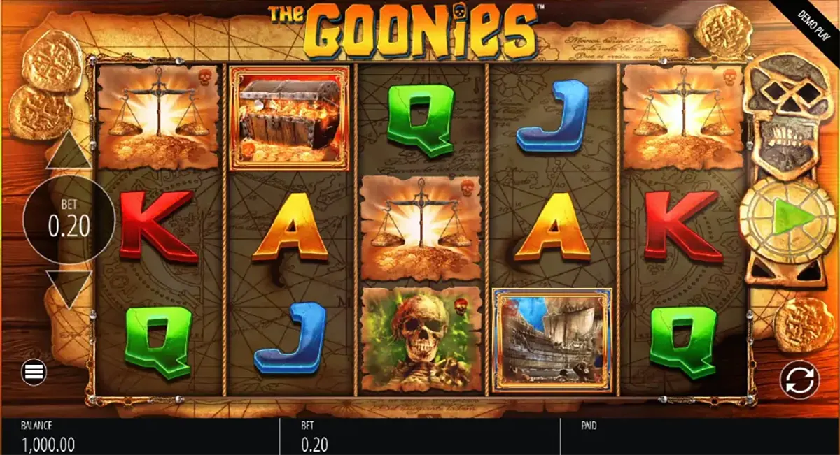 Screenshot of The Goonies slot game with five reels showing colourful card symbols (A, K, Q, J) and adventure-themed icons like a treasure chest, skull, and ship, with a bet set to 0.20 and spin controls on the right.