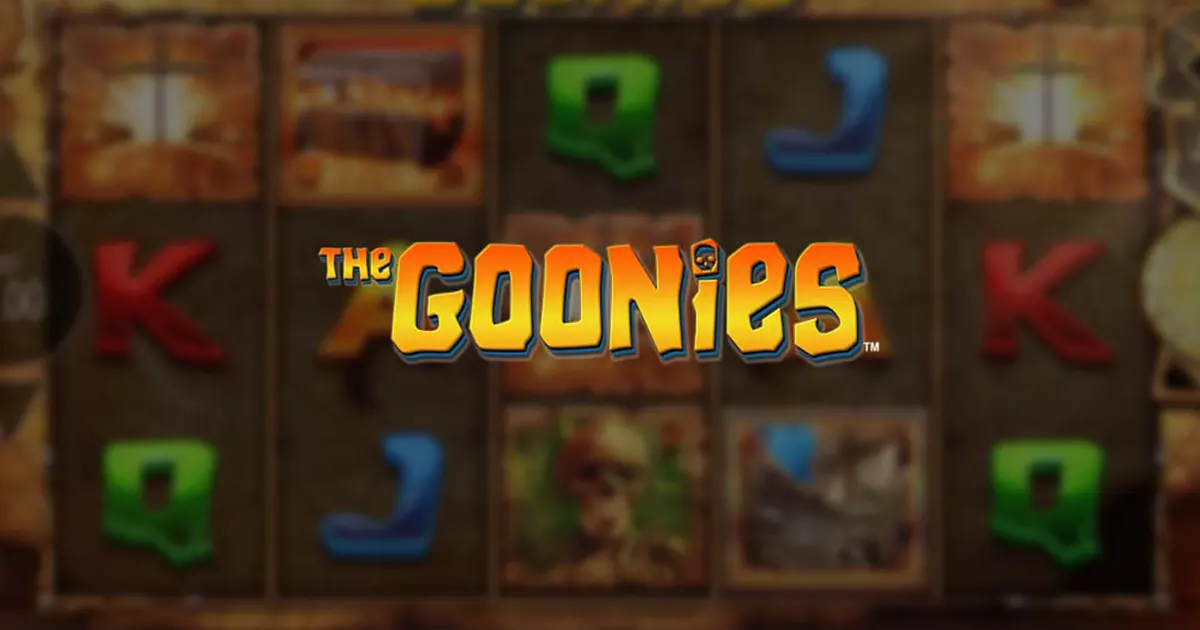 Blurred slot-game background with colourful reel symbols behind the centred “The Goonies” logo in bold yellow-and-blue lettering.